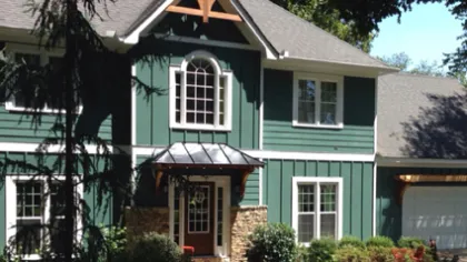 a green house with a white roof