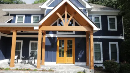a house with a wood porch