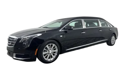 Black luxury limousine with extended body and tinted windows isolated on white background.