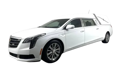 White luxury hearse with extended rear compartment and sleek design isolated on black background