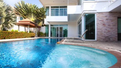 a swimming pool in front of a building