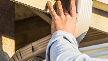 a hand holding a beam