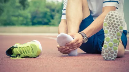 a person holding their foot