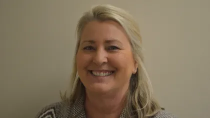 a woman smiling for the camera