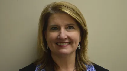 a woman smiling for the camera