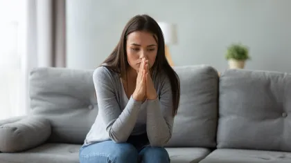 a woman sitting on a couch