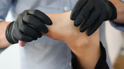 a close-up of hands wearing gloves