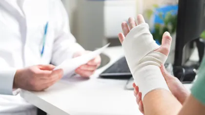 a doctor holding a patient's hand