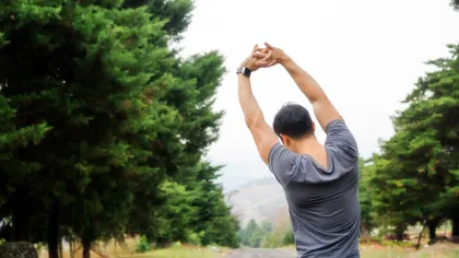a man with his arms raised