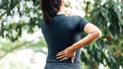 a woman with her hands on her hips