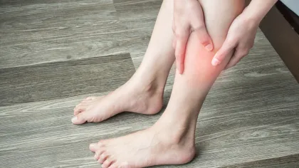 a pair of feet on a wooden surface