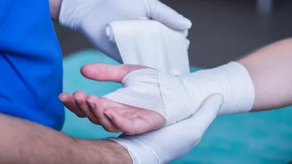 a close-up of hands holding a white cloth
