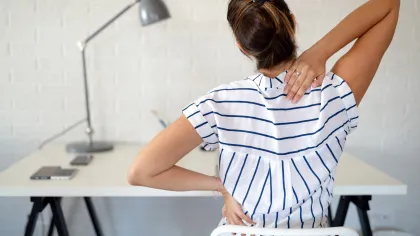 a woman sitting at a desk