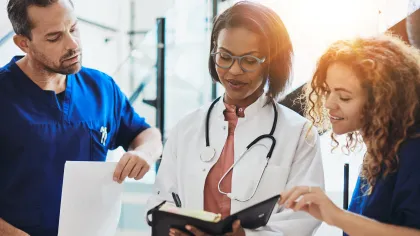a doctor showing a patient something on the tablet