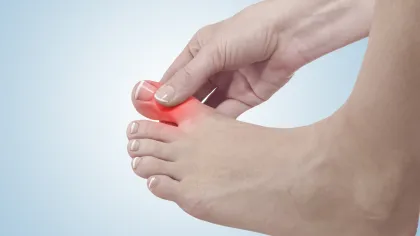 a close-up of hands holding a toe