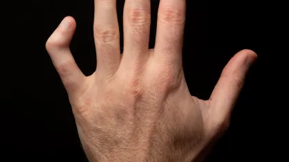 a hand with a black background