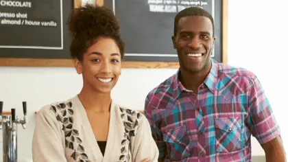 a man and a woman smiling