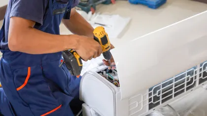a person holding a drill