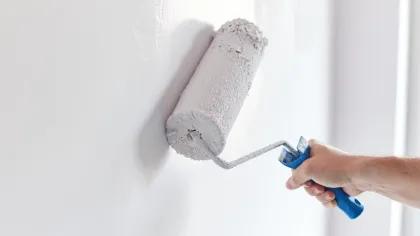 a person holding a white towel
