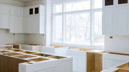 a kitchen with white cabinets