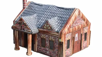 Inflatable structure designed to look like a brick house with a chimney and gabled roof on white background