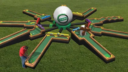A large star-shaped mini golf course with eight lanes radiating from a giant golf ball on grass outdoors.