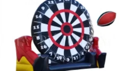 Inflatable giant dartboard with a kicking football attached, designed for interactive sports fun.