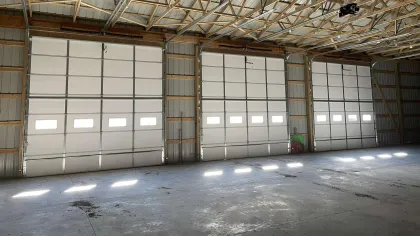 a large warehouse with many doors