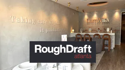 Modern wellness spa interior with a motivational quote and LumiVita brand signage on textured walls.