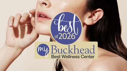 Close-up of a woman's glowing skin with a Best of 2026 myBuckhead wellness center award graphic