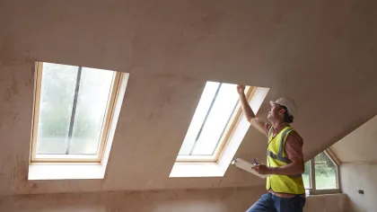 a man standing in front of a window
