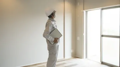 a man standing in front of a window