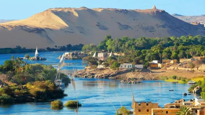a body of water with a bridge and buildings by it