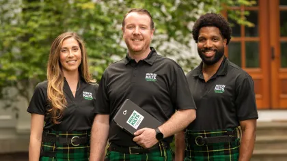 a group of people in kilts
