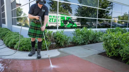 a person wearing a kilt and holding a golf club