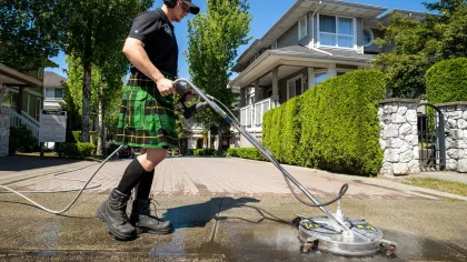 a man using a surface washer