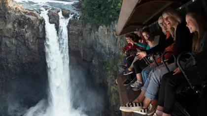 a group of people standing on top of a mountain