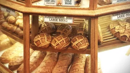 a bakery display case with pastries