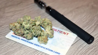 a knife next to a box of marijuana