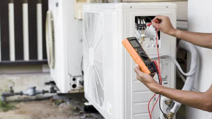 a person opening a refrigerator