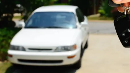 a person riding on the back of a car