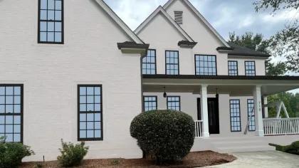 a white house with a front yard