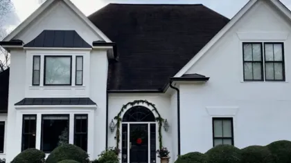 a white house with a black roof
