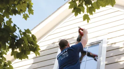 a man taking a picture of a house