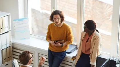 A diverse group of professionals collaborating in a modern office space.