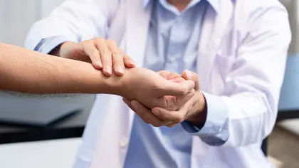 a close-up of hands shaking