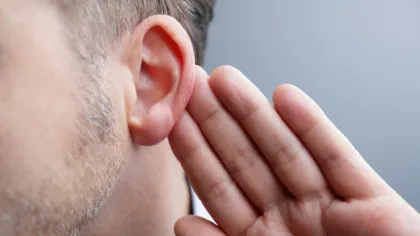 a man holding his ear