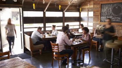 a group of people sitting at tables