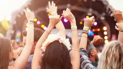a group of people holding up their hands