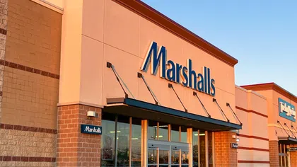 Exterior view of a Marshalls retail store with clear signage and entrance under a blue sky.